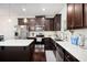 Stylish kitchen with dark wood cabinets, white countertops, stainless steel appliances at 2517 Hedgeway Cir, Kennesaw, GA 30144