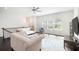 Inviting living room with hardwood floors, a ceiling fan and lots of natural light at 2517 Hedgeway Cir, Kennesaw, GA 30144