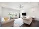 Bright living room boasts hardwood floors and natural light, with an elegant ceiling fan at 2517 Hedgeway Cir, Kennesaw, GA 30144