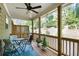 Covered patio with ceiling fan, outdoor seating, and wooded views at 2517 Hedgeway Cir, Kennesaw, GA 30144