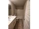 Bathroom with a single sink vanity, neutral paint, and a shower-tub combo at 2778 Wild Laurel Ct, Norcross, GA 30071