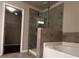 Bathroom with glass shower, tile surround and a tub at 2778 Wild Laurel Ct, Norcross, GA 30071
