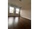 Bedroom showcasing hardwood floors and two windows that provide ample natural light at 2778 Wild Laurel Ct, Norcross, GA 30071