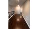 Bright hallway features hardwood floors, a railing, and neutral paint at 2778 Wild Laurel Ct, Norcross, GA 30071