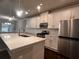 Kitchen featuring white cabinets, stainless steel appliances, an island with countertop, and dark hardwood floors at 2778 Wild Laurel Ct, Norcross, GA 30071