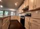 A modern kitchen showcasing white cabinets, subway tile backsplash, and stainless steel appliances at 2778 Wild Laurel Ct, Norcross, GA 30071
