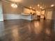 Open-concept living room and kitchen area with dark wood floors and lots of natural light at 2778 Wild Laurel Ct, Norcross, GA 30071