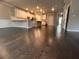 Open concept living and kitchen area with hardwood floors, recessed lighting, and neutral wall paint at 2778 Wild Laurel Ct, Norcross, GA 30071