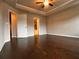 Spacious main bedroom featuring hardwood floors and a tray ceiling at 2778 Wild Laurel Ct, Norcross, GA 30071