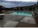 Community pool with patio furniture and a line of townhomes in the background at 2778 Wild Laurel Ct, Norcross, GA 30071