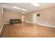 Finished basement with a couch and door to another room at 5247 Yeager Rd, Douglasville, GA 30135