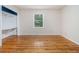Bedroom with hardwood flooring, closet, and window with natural light at 5247 Yeager Rd, Douglasville, GA 30135