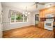 Bright kitchen with wood cabinetry and ample natural light, adjoining a dining area at 5247 Yeager Rd, Douglasville, GA 30135