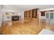 Large living room with hardwood floors, a piano, and access to the dining room at 5247 Yeager Rd, Douglasville, GA 30135