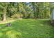 Spacious backyard with lush greenery and mature trees, offering a serene outdoor setting at 364 Stafford Sw St, Marietta, GA 30064