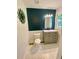 Updated bathroom features a gray vanity, a decorative mirror and hexagon tiled floors at 364 Stafford Sw St, Marietta, GA 30064