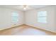 A spacious bedroom featuring hardwood floors and lots of natural light with views from the dual windows at 364 Stafford Sw St, Marietta, GA 30064