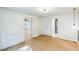 Open bedroom layout with wood floors, white walls, and access to the bathroom at 364 Stafford Sw St, Marietta, GA 30064