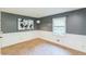 Cozy bedroom features stylish gray walls, white trim, a window, and modern lighting at 364 Stafford Sw St, Marietta, GA 30064