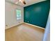 Bedroom showcasing a window for natural light and an accent wall at 364 Stafford Sw St, Marietta, GA 30064