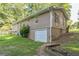 Exterior view of the home featuring a garage and well-maintained lawn at 364 Stafford Sw St, Marietta, GA 30064