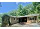 Charming home with neutral siding, black shutters, and mature landscaping at 364 Stafford Sw St, Marietta, GA 30064