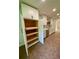 Spacious kitchen with a cabinet offering pull-out shelves and a view to the sink at 364 Stafford Sw St, Marietta, GA 30064