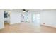 Open living area with wood floors, white walls, and access to the back patio at 364 Stafford Sw St, Marietta, GA 30064