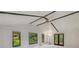 Bright living room with vaulted ceiling, exposed beams, and backyard views at 364 Stafford Sw St, Marietta, GA 30064