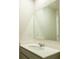 Bathroom vanity with light colored cabinet, white sink, and large mirror at 2804 Georgia Aster Way Nw, Atlanta, GA 30318