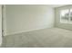 This bedroom is bathed in natural light, highlighting the soft, neutral carpet, freshly painted walls at 2804 Georgia Aster Way Nw, Atlanta, GA 30318