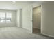 Bright bedroom with a walk-in closet with an open door provides generous storage space at 2804 Georgia Aster Way Nw, Atlanta, GA 30318