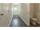 Inviting entryway featuring wood floors and a convenient half bathroom at 2804 Georgia Aster Way Nw, Atlanta, GA 30318