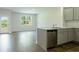 Open-concept kitchen with granite countertops and stainless steel appliances at 2804 Georgia Aster Way Nw, Atlanta, GA 30318