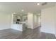 Open-concept living space with bright lighting and wood flooring at 2804 Georgia Aster Way Nw, Atlanta, GA 30318