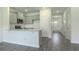 Spacious living area and kitchen with wood flooring at 2804 Georgia Aster Way Nw, Atlanta, GA 30318