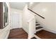 A stairway with wooden treads and white risers leads to the upper level at 2808 Broughton Se Ln, Atlanta, GA 30339