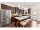 Spacious kitchen with stainless steel appliances, granite island, and seating for three at 2808 Broughton Se Ln, Atlanta, GA 30339