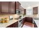 Gourmet kitchen featuring stainless steel appliances and granite countertops at 2808 Broughton Se Ln, Atlanta, GA 30339