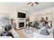Elegant living room with fireplace flows into dining area with natural light at 2808 Broughton Se Ln, Atlanta, GA 30339