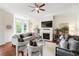 Bright living room boasts hardwood floors, a cozy fireplace, and stylish neutral furnishings at 2808 Broughton Se Ln, Atlanta, GA 30339