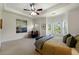 Bright main bedroom featuring a ceiling fan, lots of natural light, and neutral paint at 2808 Broughton Se Ln, Atlanta, GA 30339