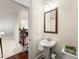 Well-appointed powder room with pedestal sink and classic fixtures, conveniently located at 2808 Broughton Se Ln, Atlanta, GA 30339