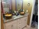 Stylish bathroom featuring double bowl sinks, granite countertops and ample storage space at 710 Oxford Crest Ct, Lawrenceville, GA 30043
