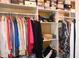 Organized closet with rods and shelves, offering ample storage space for clothing and accessories at 710 Oxford Crest Ct, Lawrenceville, GA 30043