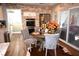 Eat-in kitchen featuring stainless steel appliances, brick accent wall, and a sliding glass door to the outside at 710 Oxford Crest Ct, Lawrenceville, GA 30043