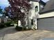 Long driveway leading to a well-maintained home with lush landscaping at 710 Oxford Crest Ct, Lawrenceville, GA 30043