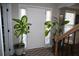Bright entryway with decorative plants, natural light, and hardwood floors at 710 Oxford Crest Ct, Lawrenceville, GA 30043