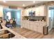 Charming kitchen featuring white cabinetry, granite countertops and stainless steel appliances at 710 Oxford Crest Ct, Lawrenceville, GA 30043