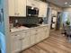 Modern kitchen with stainless steel appliances, granite countertops, and beautiful tile backsplash at 710 Oxford Crest Ct, Lawrenceville, GA 30043